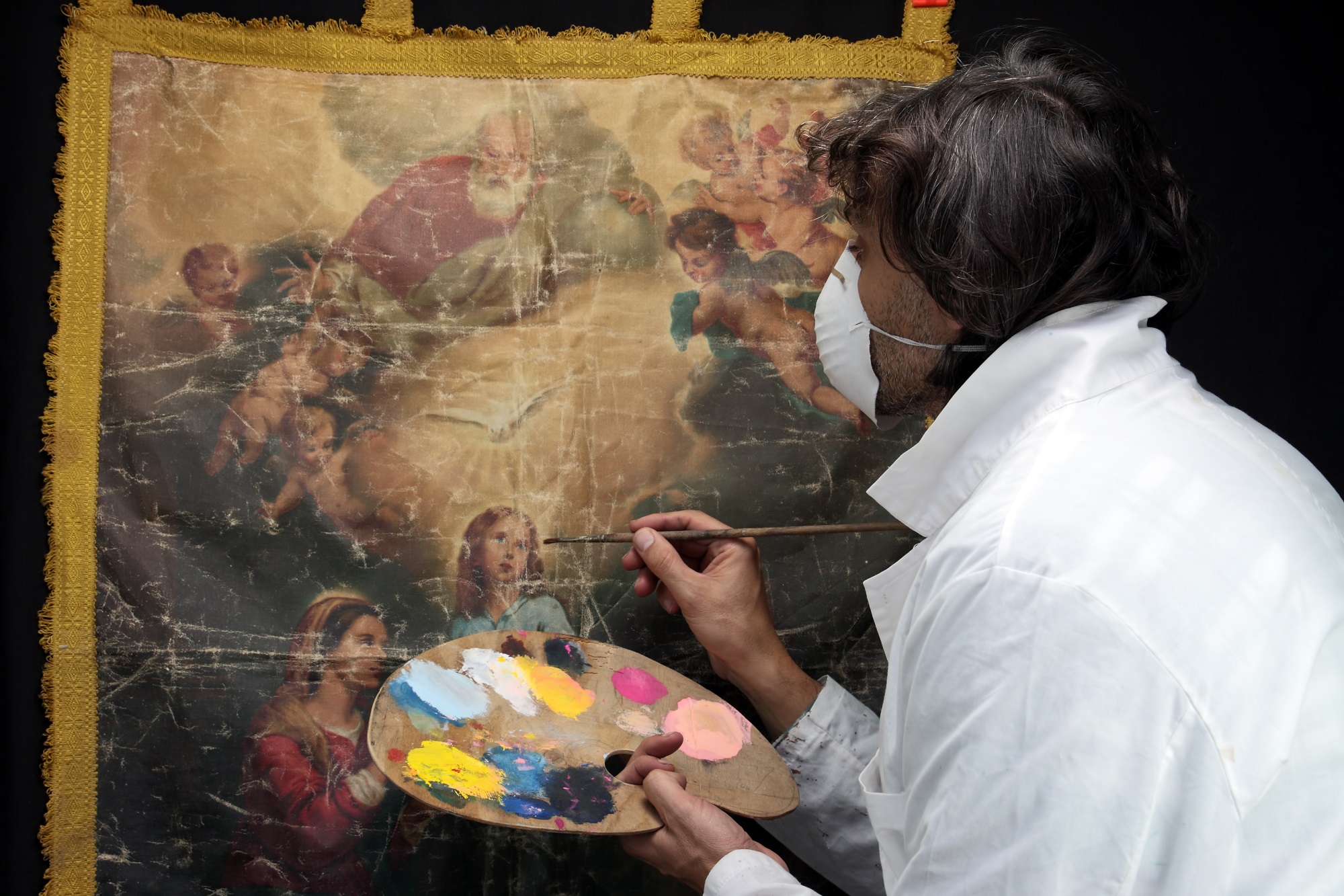 Restorer Working On Oil Painting Canvas